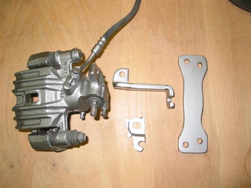 Rear brake caliper with adapter parts